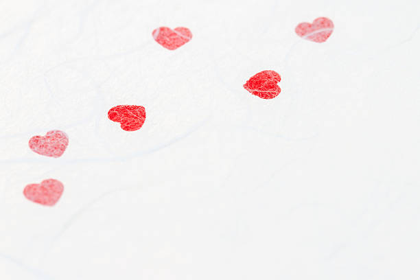 istock Abstract blurred of red heart on white mulberry paper texture. 627712946
