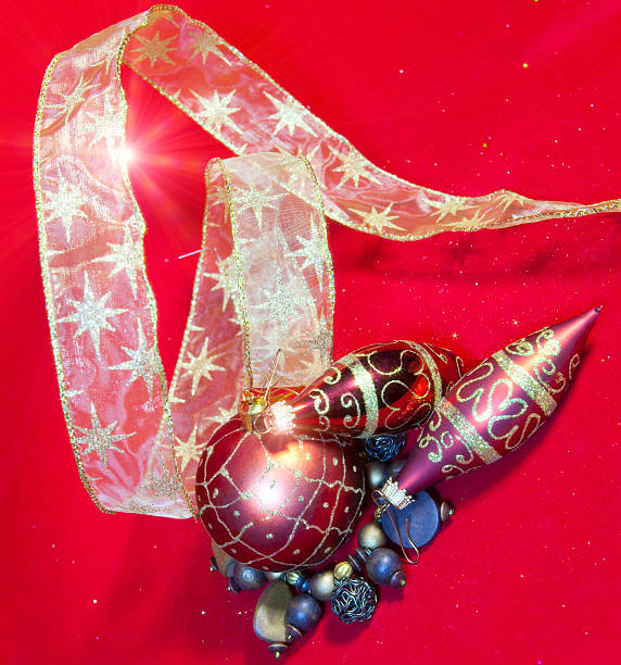 istock New Year's composition on  red background - ball and ribbon 627718400