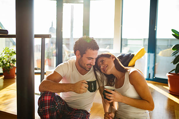 istock Affectionate couple enjoying  morning coffee and flirting 627720334
