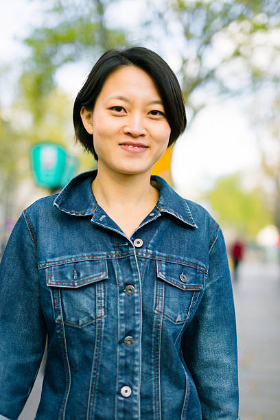 istock Young chinese female enjoying her trip to Paris 627721246