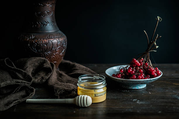 Viburnum with honey on table stock photo