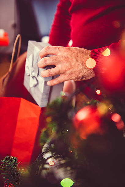 istock Man taking out present from a shopping bag 627724444