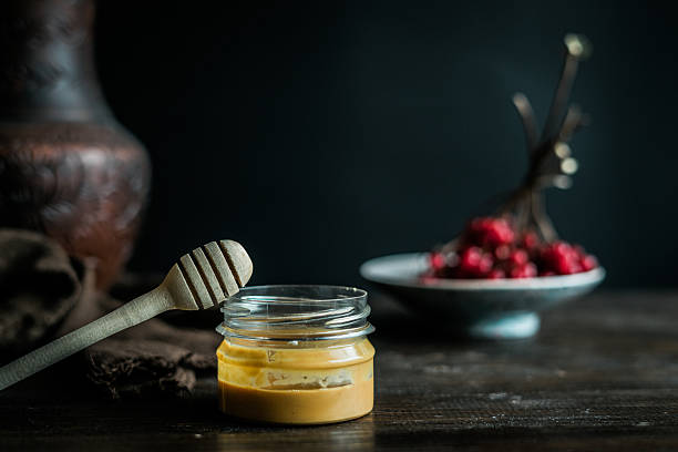 Viburnum with honey on table stock photo