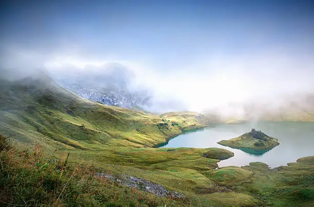 fog over alpine lake in mountains, Germany