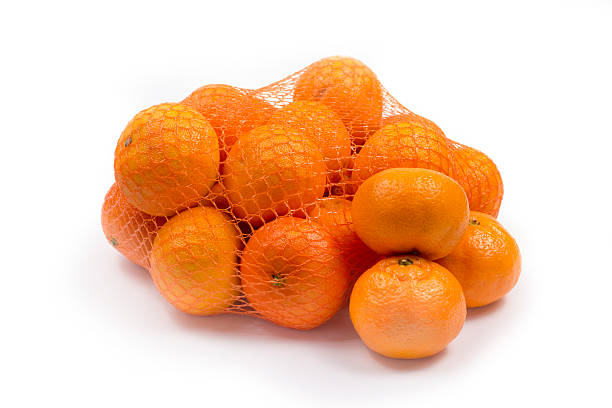 istock Ripe orange tangerines in the grid 627739500