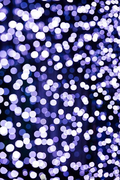 istock defocused christmas decoration blue lights against black background 627740080