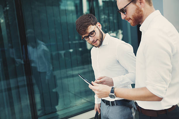istock Business people walking and discussing news 627740232