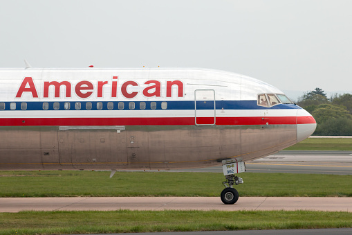 Manchester, United Kingdom - May 8, 2016: American Airlines Boeing 767-323(ER) wide-body passenger plane (N362AA) taxiing on Manchester International Airport tarmac.