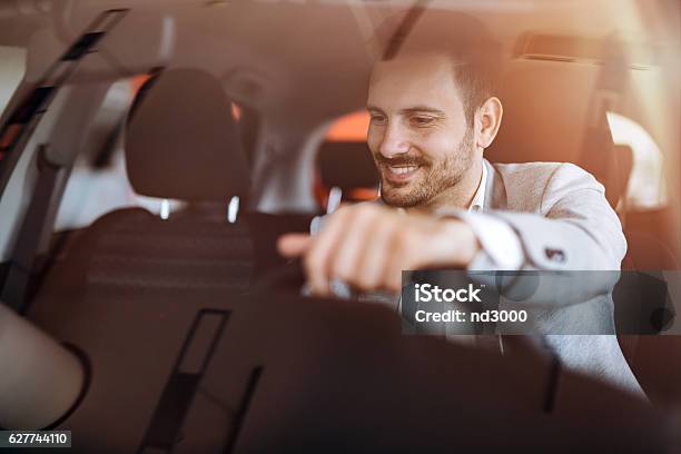 Handsome Businessman Driving Car Stock Photo - Download Image Now - Car, Driving, Men