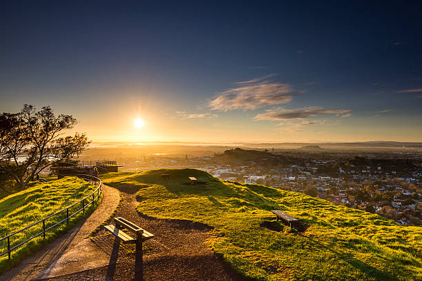 Sunrise from Mount Eden Another beautiful, but chilly, day dawns in Auckland. auckland stock pictures, royalty-free photos & images