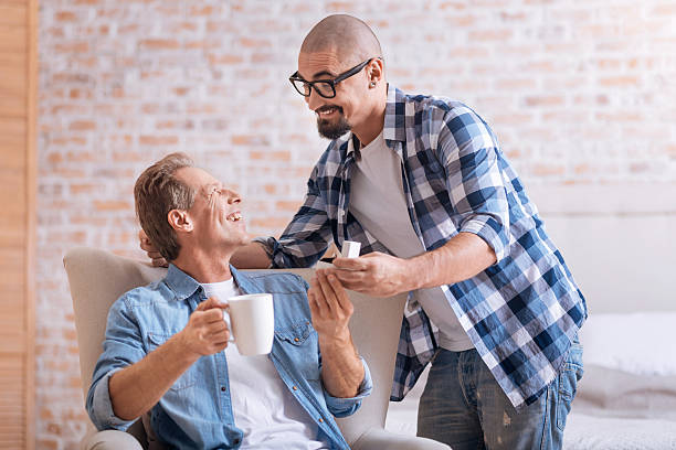 istock Cheerful young man making the proposal to his aged partner 627744950