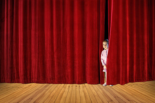 istock little girl on stage 627745252