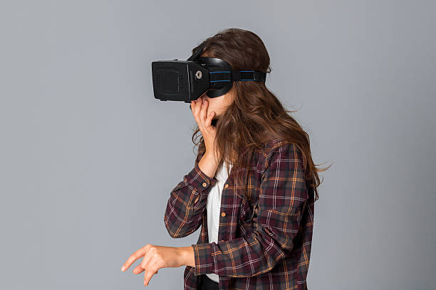 istock young beautiful girl in virtual reality helmet 627746058