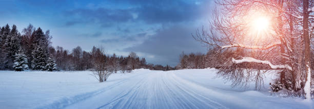 istock road in snowy winter on beautiful sunny day 627746834
