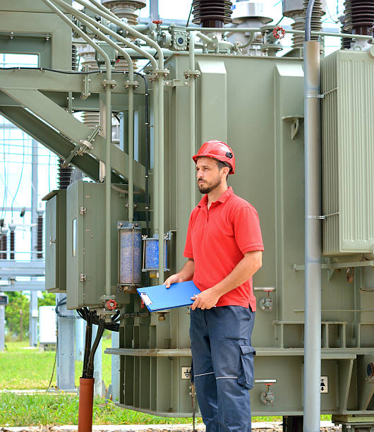 istock Electrician Working Near High Voltage Transformer 627747966