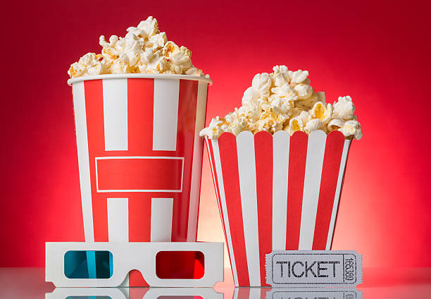 istock Large and small popcorn boxes, a ticket to the movies 627748620