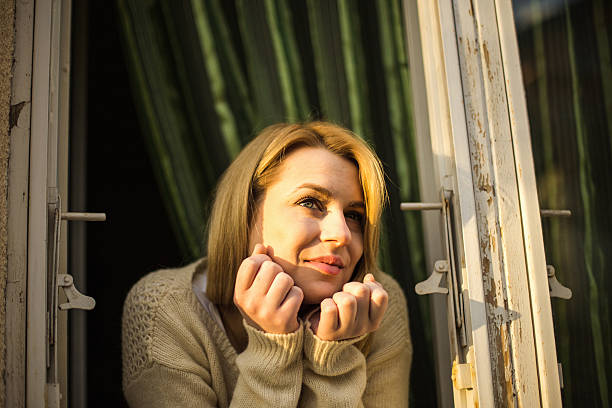 istock Sensual blond hair woman taking first sun rays 627759340