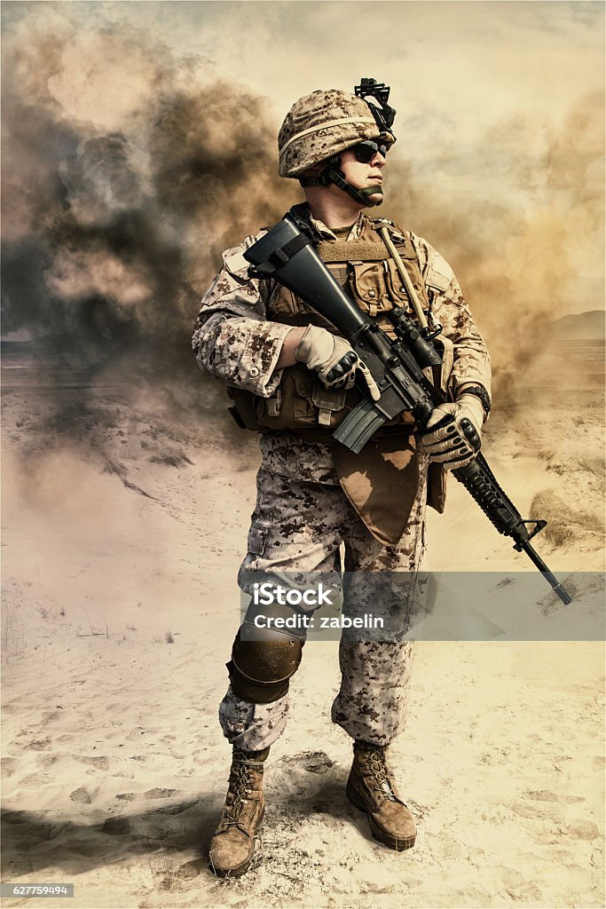 US marine in the desert Close-up photo of US marine with his rifle Army Soldier Stock Photo