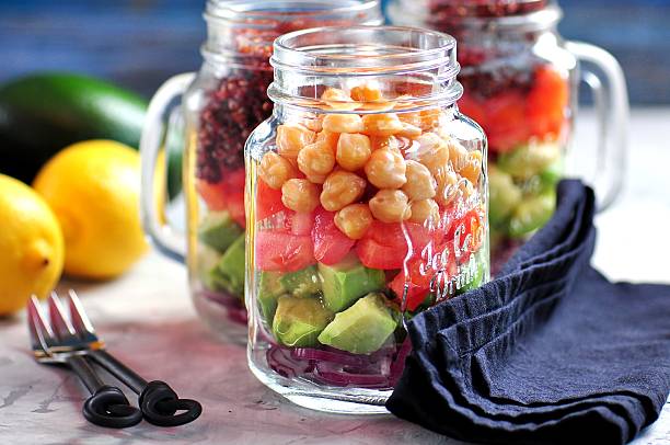 istock Healthy salad with quinoa and chickpeas, avocado, tomato, red onion 627759562