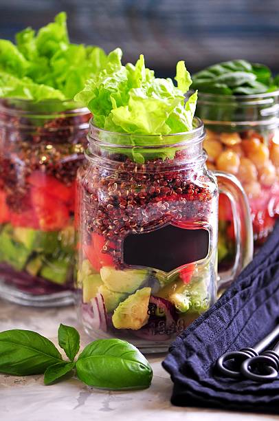 istock Healthy salad with quinoa and chickpeas, avocado, tomato, red onion 627760190