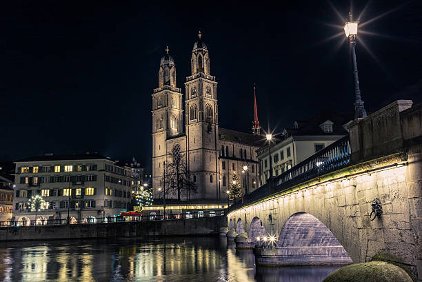 istock Grossmunster in Zurich from the Limmat at night - 4 627760528