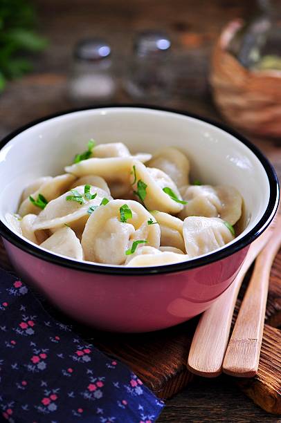 istock Homemade dumplings with beef, onion and parsley. Rustic style. 627760610