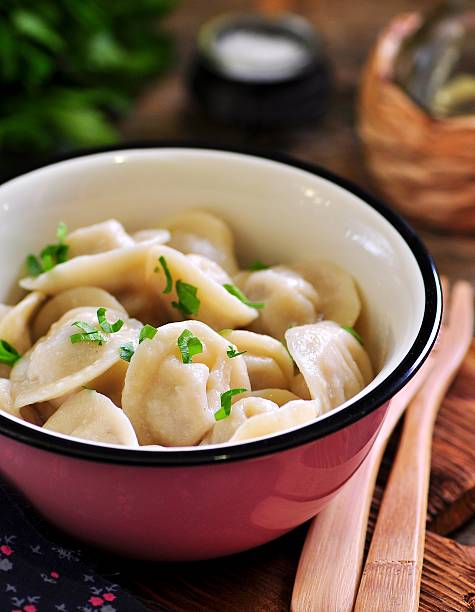 istock Homemade dumplings with beef, onion and parsley. Rustic style. 627760746