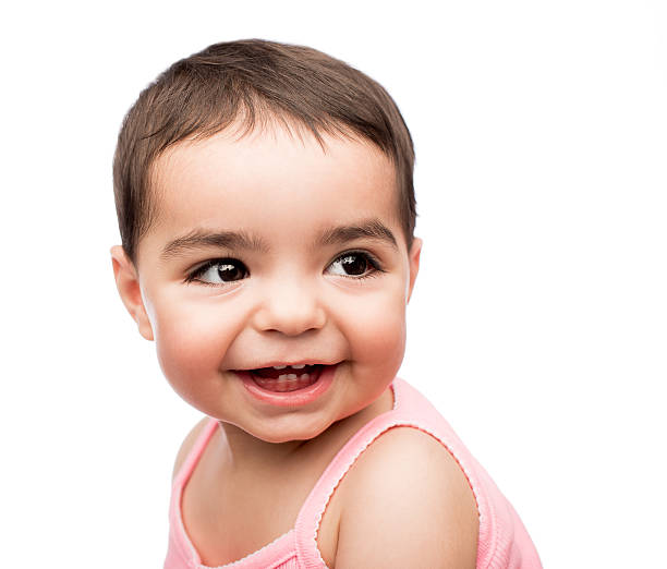 istock Latin baby girl smiling and looking over shoulder 627761796