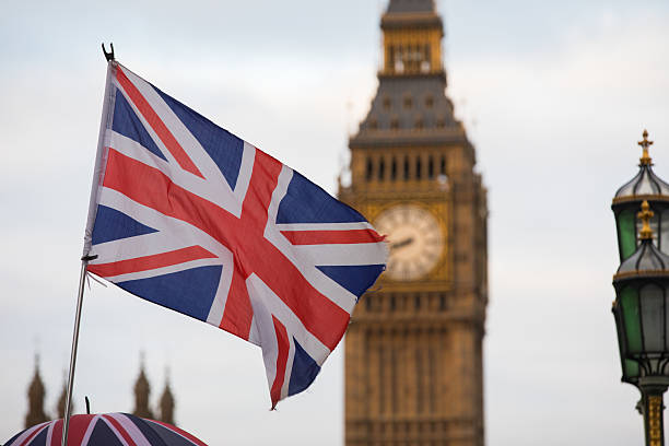 istock Union Jack flag and Big Ben in background 627769922