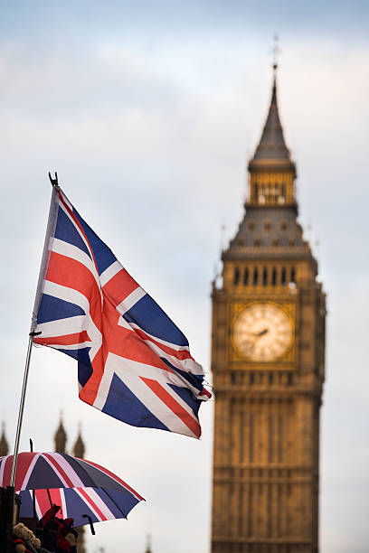 istock Union Jack flag and Big Ben in background 627770612