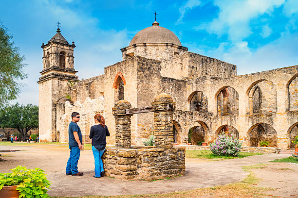 San Antonio, USA - November 7, 2016: Visitors rest at Mission San Jose, part of the San Antonio Missions UNESCO World Heritage Site. Mission San Jose was a Spanish colonial mission founded in 1720, near San Antonio, Texas.
