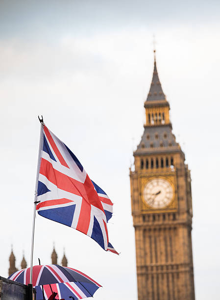 istock Union Jack flag and Big Ben in background 627771312