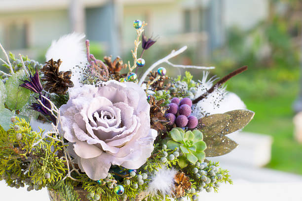 istock Bouquet has Christmas tree branches and artificial flowers. 627771568