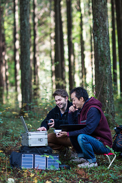 istock Two researchers working at a solar powered field station 627771582