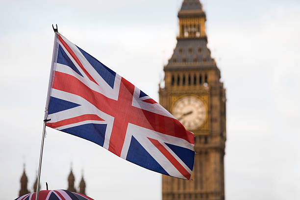istock Union Jack flag and Big Ben in background 627776442