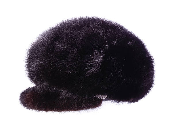 istock Women's fur hat with a visor is isolated on white 627776586