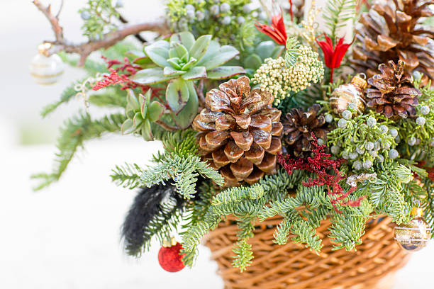 istock Bouquet has Christmas tree branches and artificial flowers. 627776974