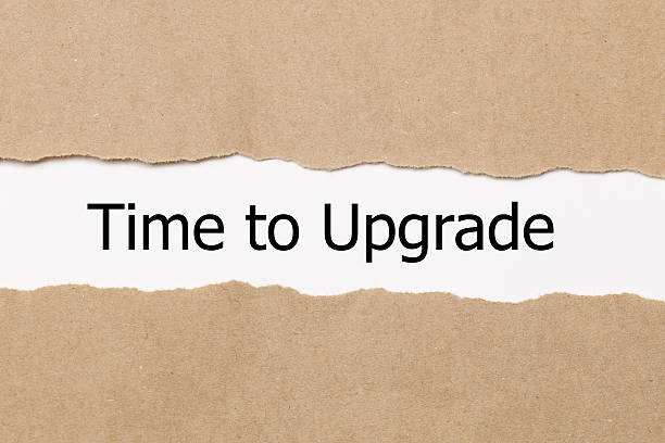 istock TIME TO UPGRADE written under torn paper. 627778486