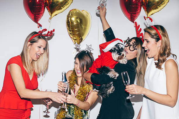 Celebration Four young woman blowing confetti and having fun 3686 stock pictures, royalty-free photos & images