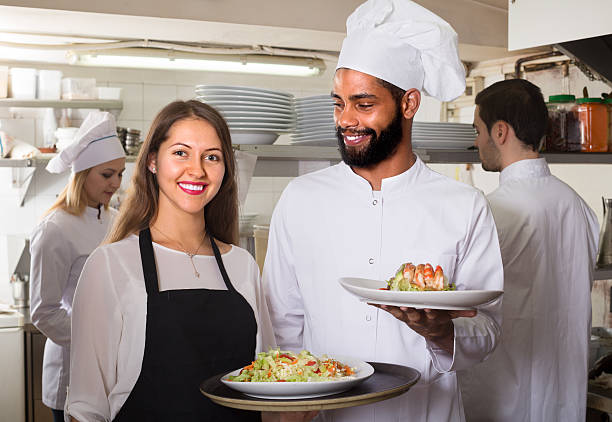 istock Portrait of positive kitchen workers 627780900