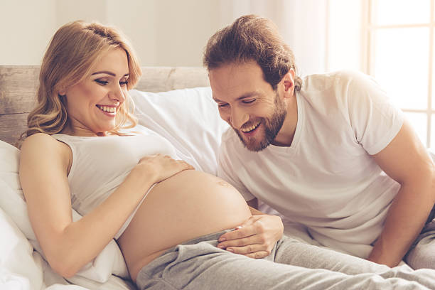 Happy couple waiting for baby stock photo