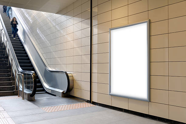 vertical light box poster mockup in metro station. - staalplaat stockfoto's en -beelden