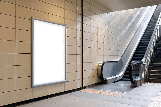 istock Vertical light box poster mockup in metro station. 627787720
