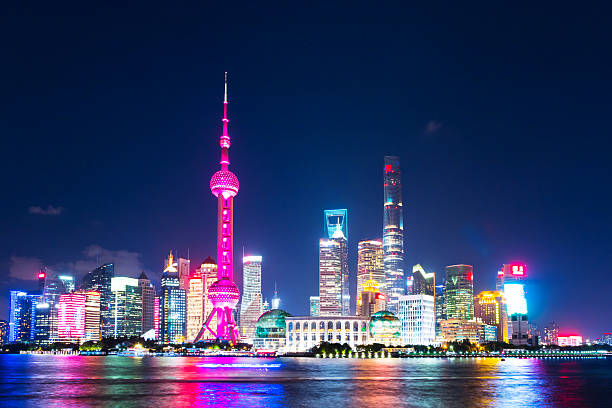 istock modern office buildings near illuminated orient pearl tower 627794638