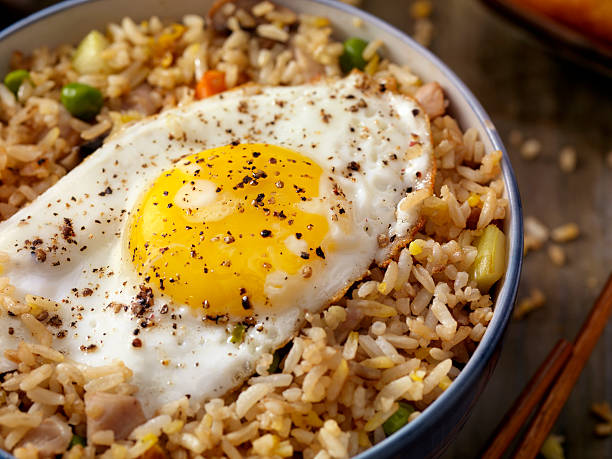 breakfast fried egg with rice - table macro still life studio shot imagens e fotografias de stock