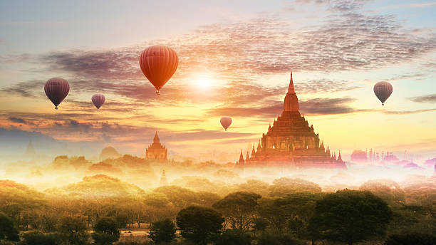 istock Hot air balloon over plain of Bagan in misty morning 627795522