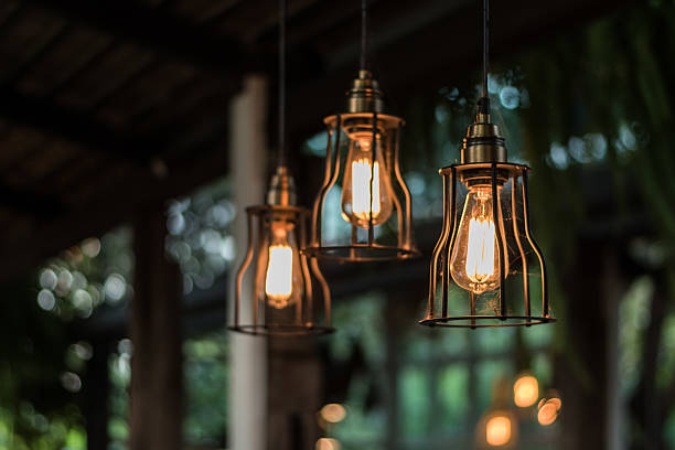 istock beautiful Light bulb incandescent hanging decorated interior roo 627795962