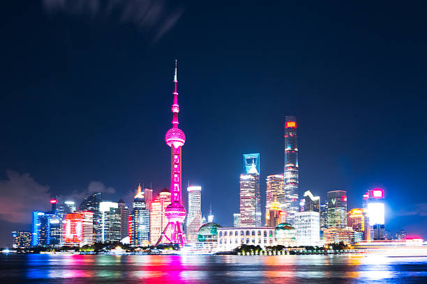 istock modern office buildings near illuminated orient pearl tower by r 627795974