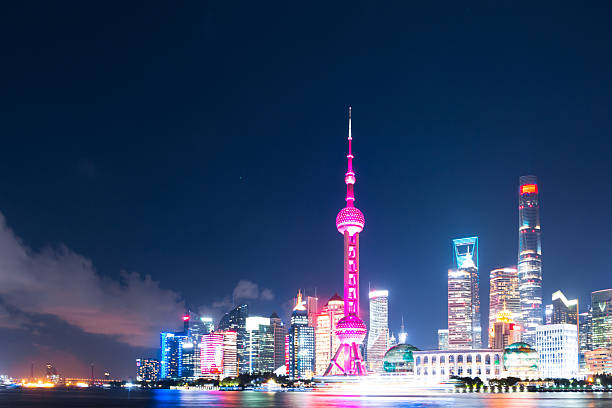 istock modern office buildings near illuminated orient pearl tower by r 627796010
