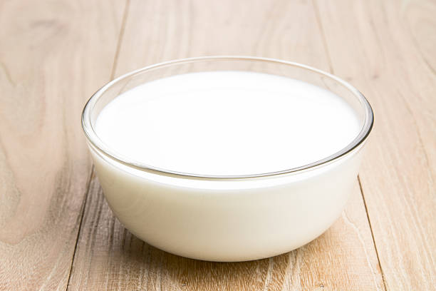 Milk in the bowl stock photo